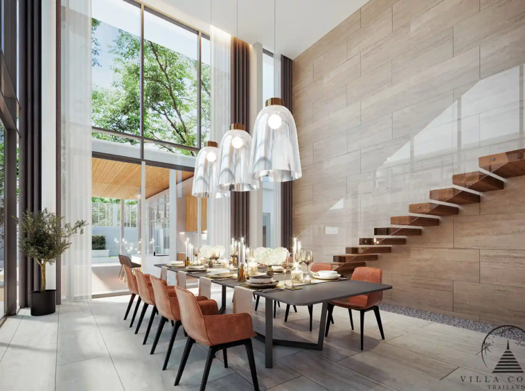 The Laytin Villa Bangtao, showcasing the elegant modern architecture and lush tropical surroundings