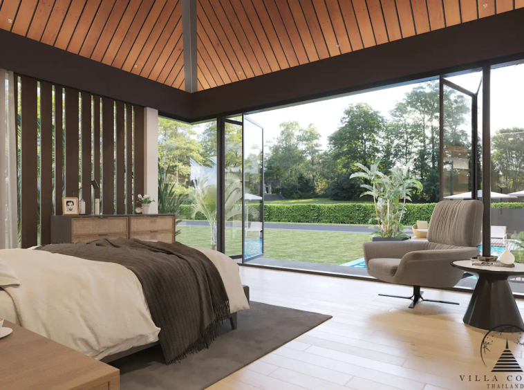 Villa Suksan, showcasing its modern architecture, spacious sundeck, and lush tropical surroundings.