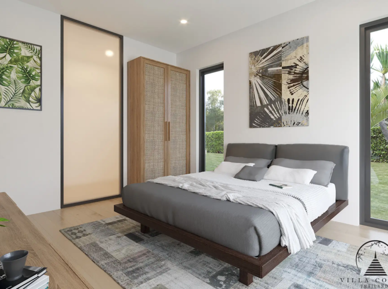 Villa Suksan, showcasing its modern architecture, spacious sundeck, and lush tropical surroundings.