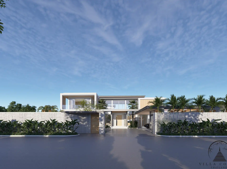 The Laytin Villa Bangtao, showcasing the elegant modern architecture and lush tropical surroundings
