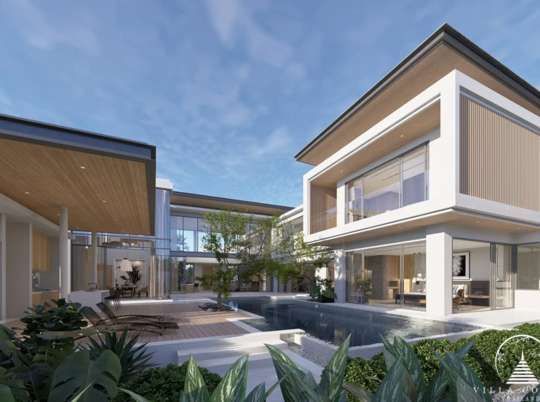The Laytin Villa Bangtao, showcasing the elegant modern architecture and lush tropical surroundings