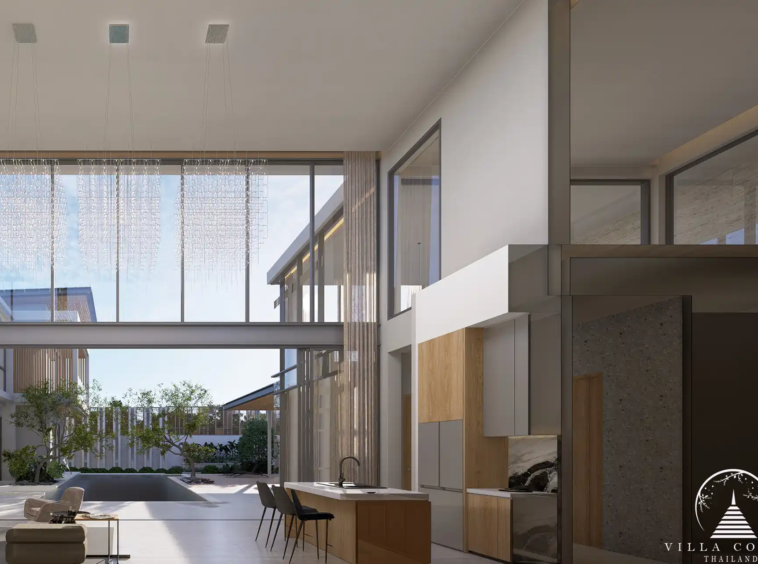 The Laytin Villa Bangtao, showcasing the elegant modern architecture and lush tropical surroundings