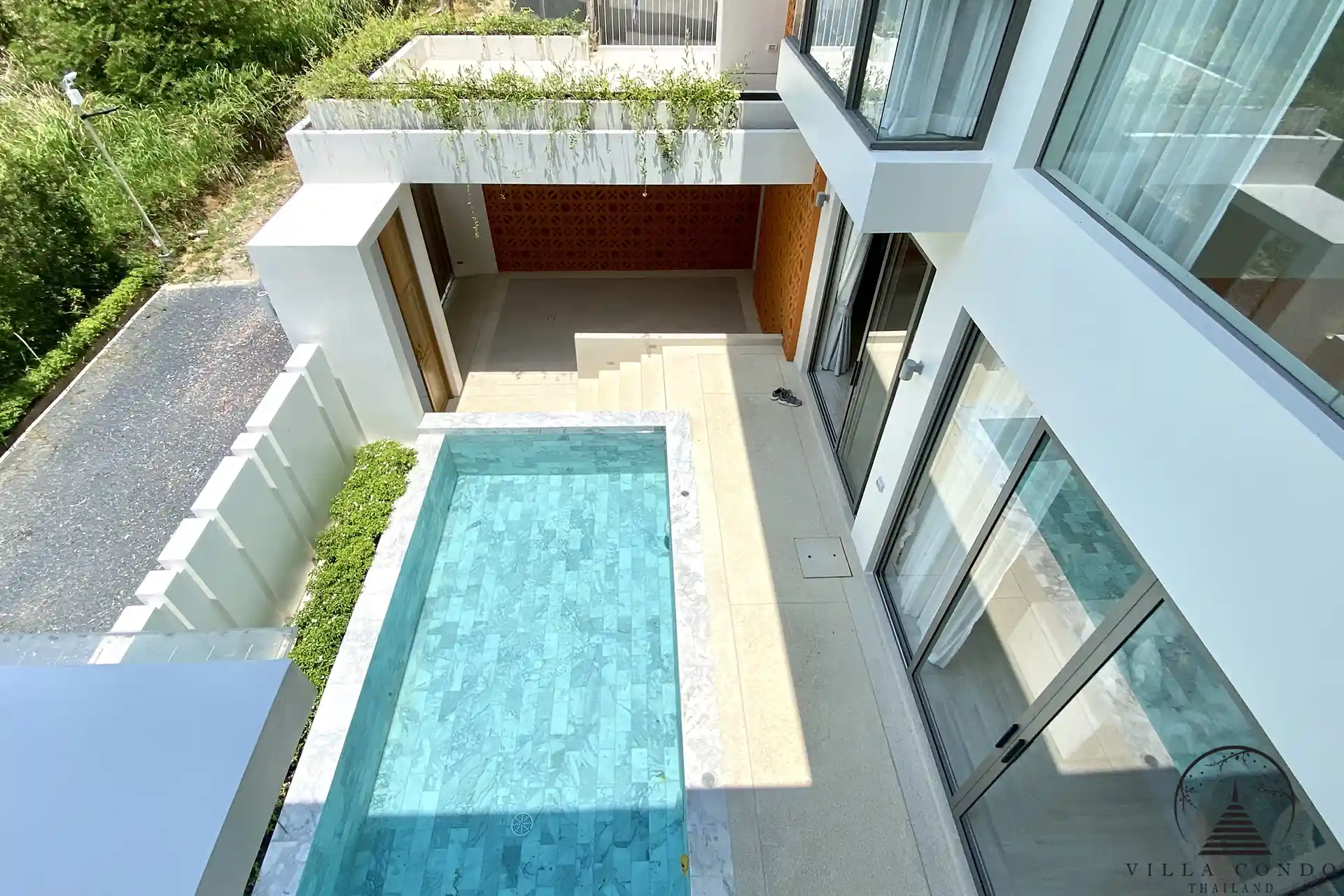 Private swimming pool with sun deck at Alisa Pool Villas.
