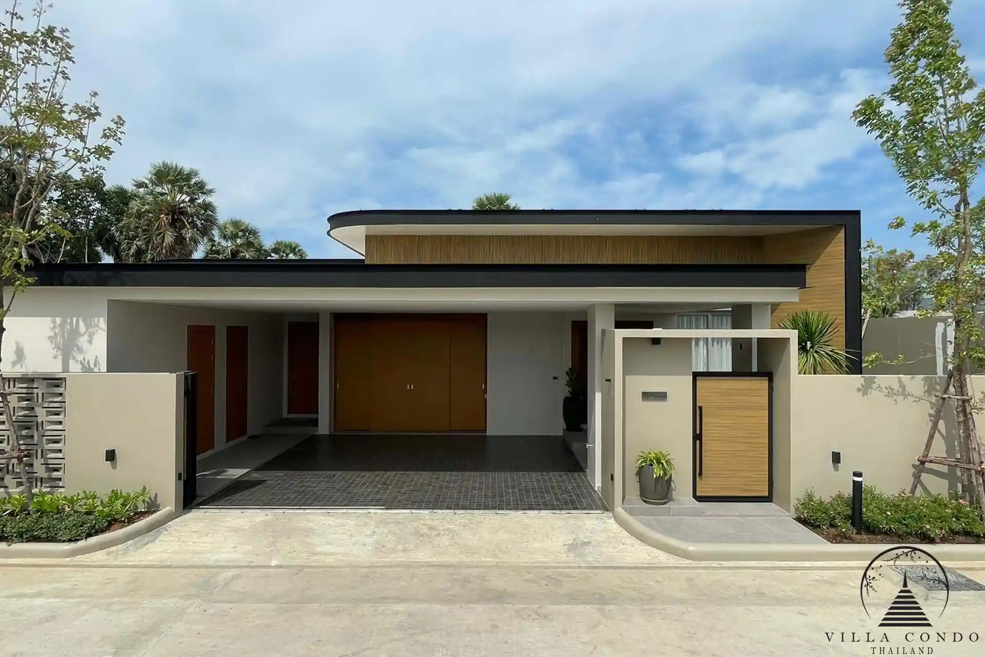 Elegant front gate of Alinda Villas with modern design.