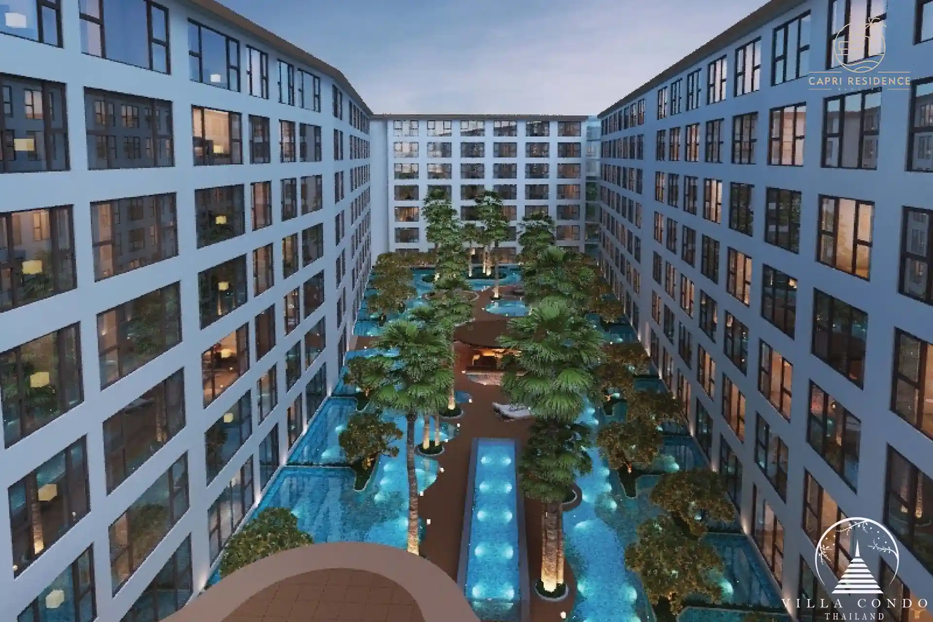 Exterior view of Capri Residence Bangtao, showcasing the modern architectural design amidst lush tropical surroundings.