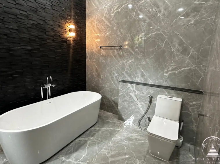 Elegant master bathroom with modern fixtures and natural light.
