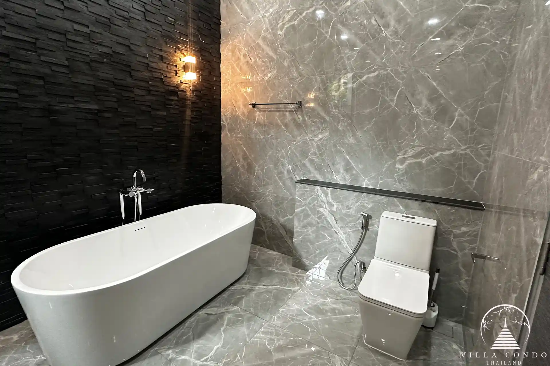 Elegant master bathroom with modern fixtures and natural light.