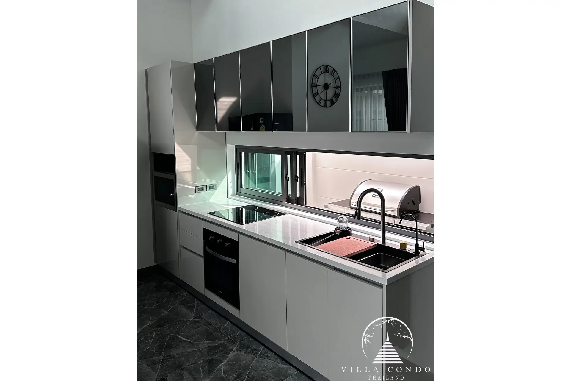 Fully-equipped modern kitchen with stylish design.