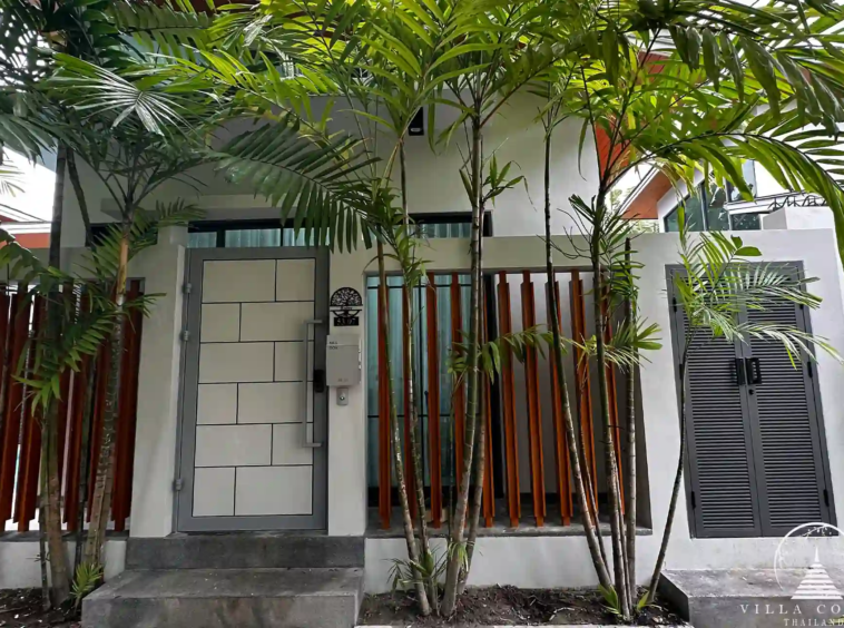 Exterior view of Crystal Villa with modern design and lush surroundings.
