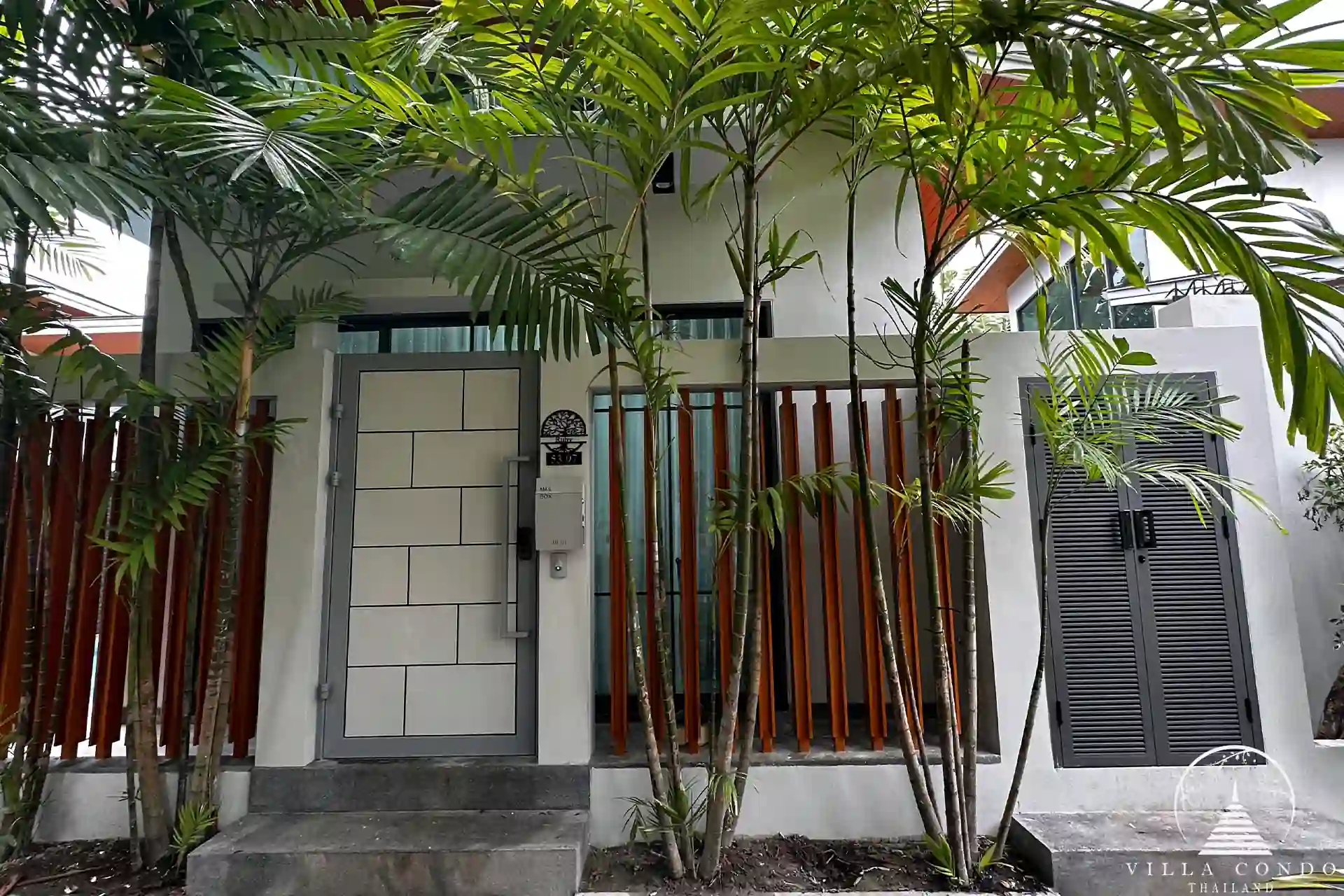Exterior view of Crystal Villa with modern design and lush surroundings.