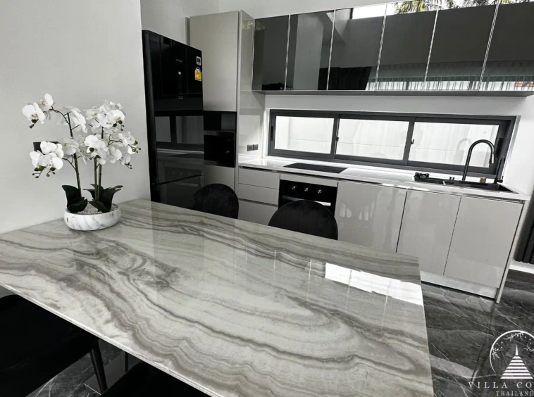 Elegant living area with plush sofa and entertainment setup.