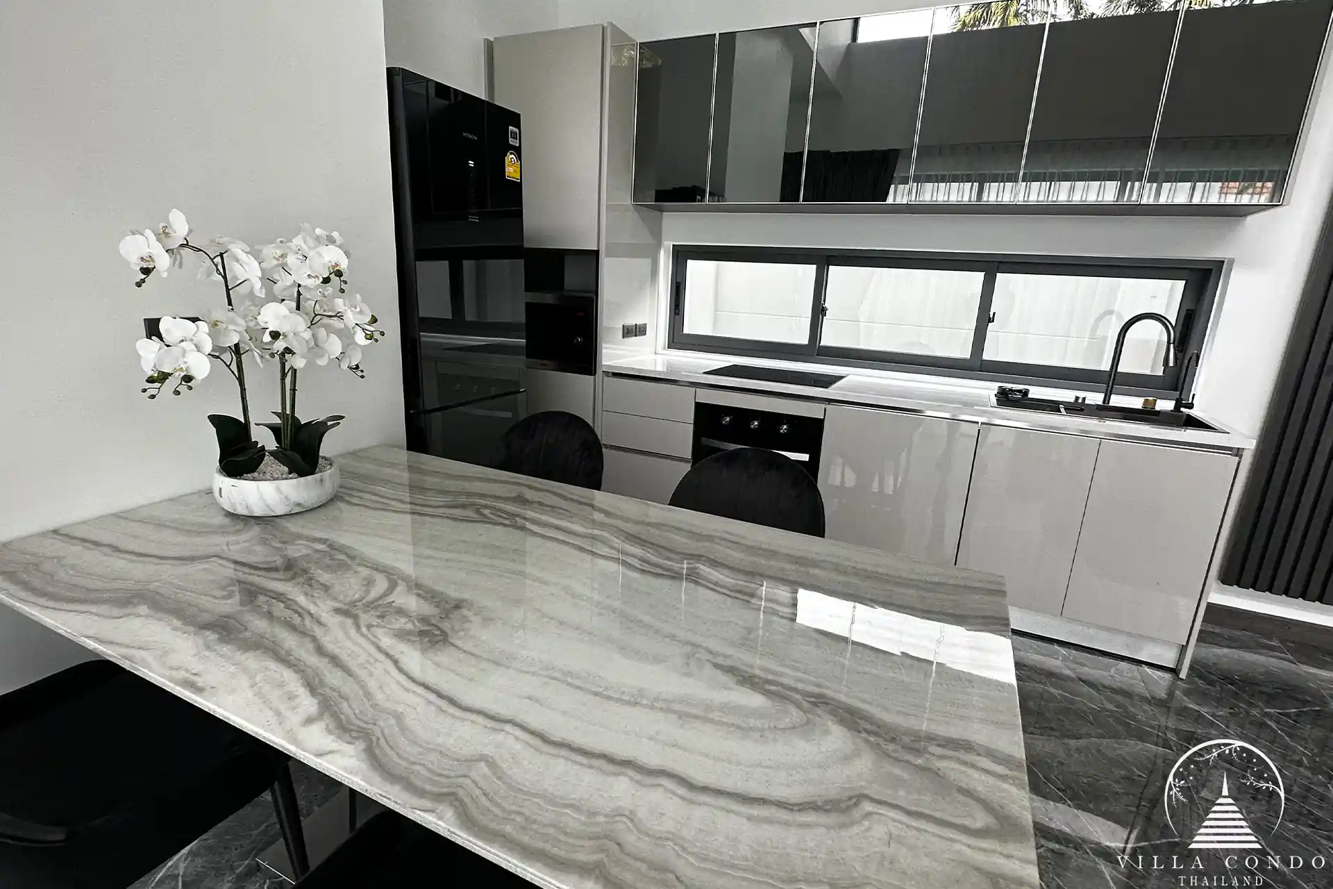 Elegant living area with plush sofa and entertainment setup.