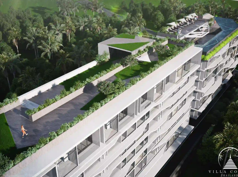 The lush garden area at Enigma Residence with tropical landscaping.