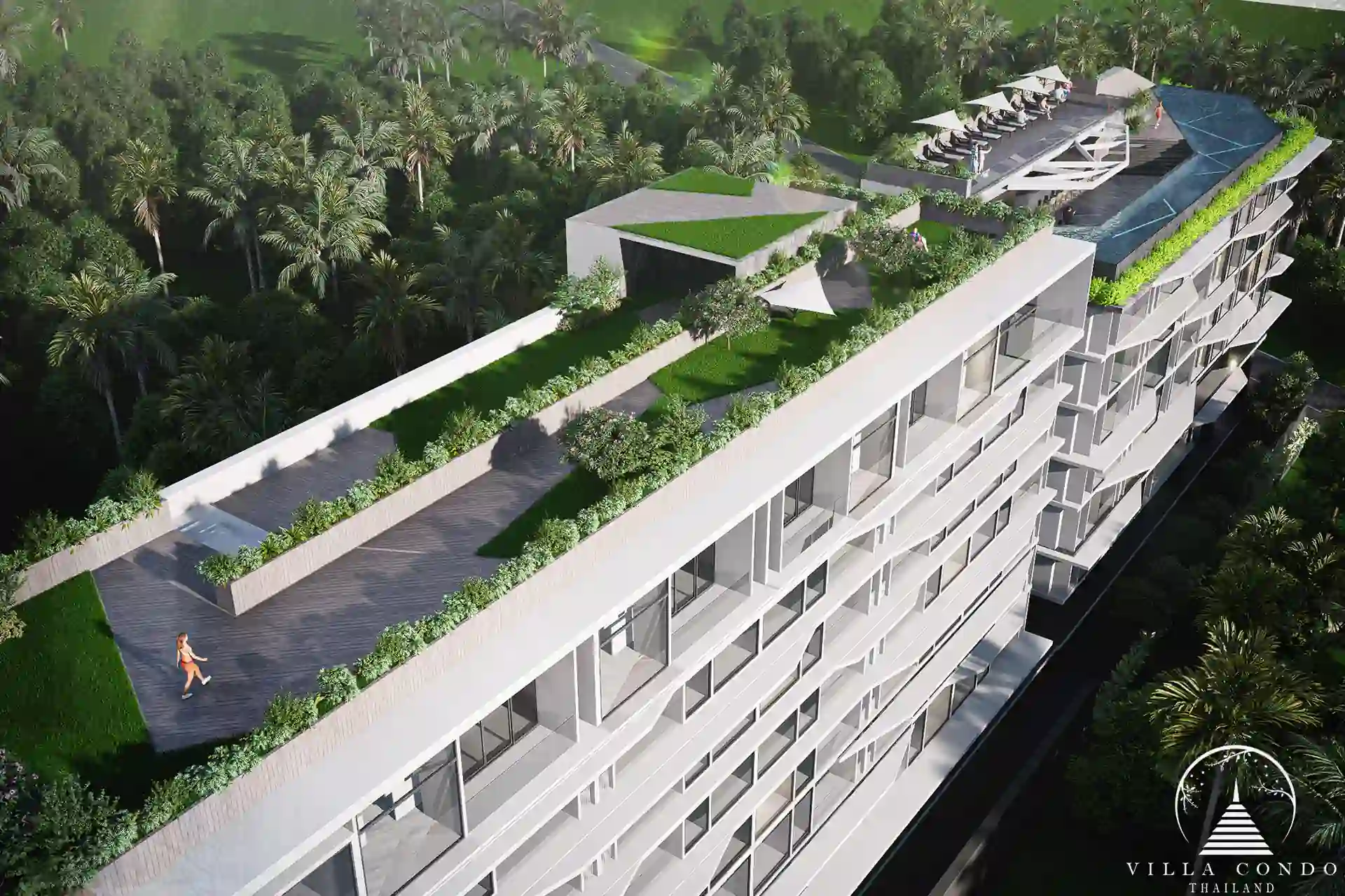 The lush garden area at Enigma Residence with tropical landscaping.