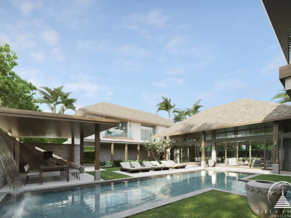 The outdoor area at QAV Residence with sunbeds by the pool.