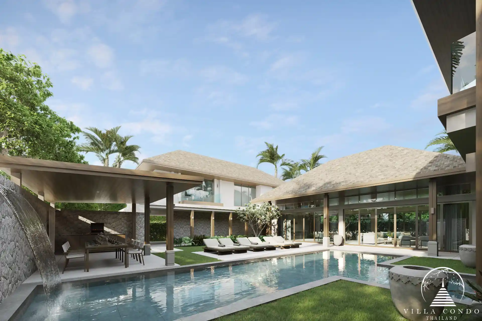 The outdoor area at QAV Residence with sunbeds by the pool.