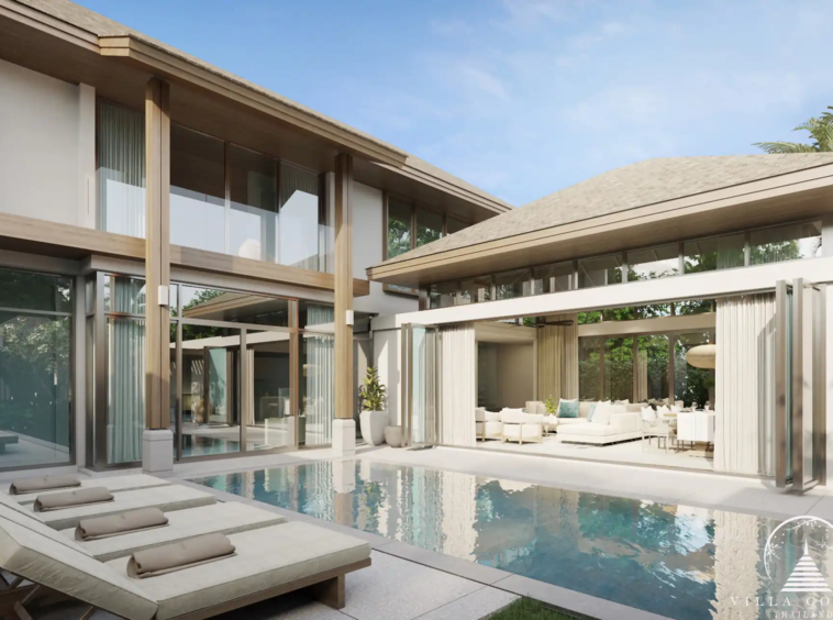 The outdoor area at QAV Residence with sunbeds by the pool.