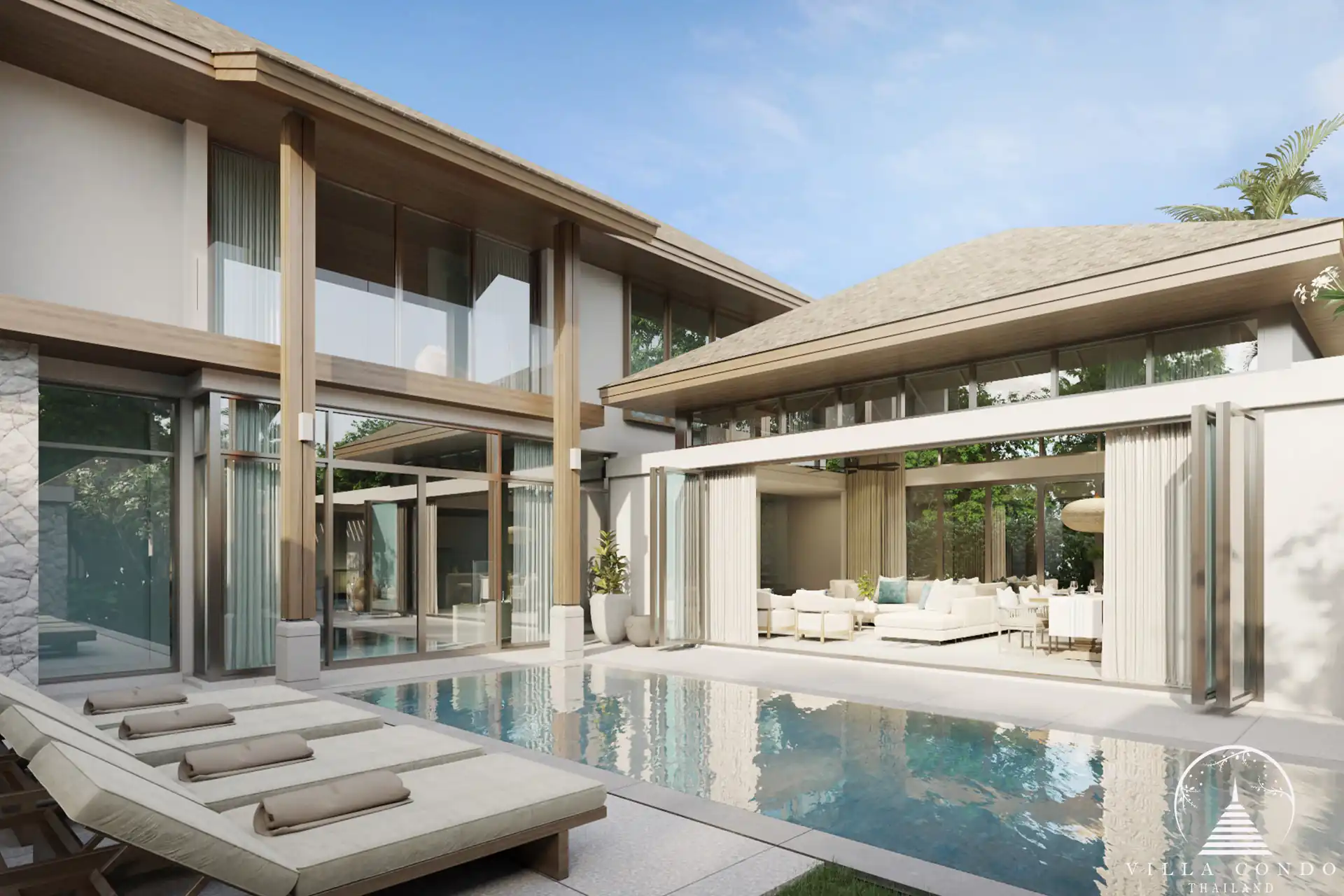 The outdoor area at QAV Residence with sunbeds by the pool.