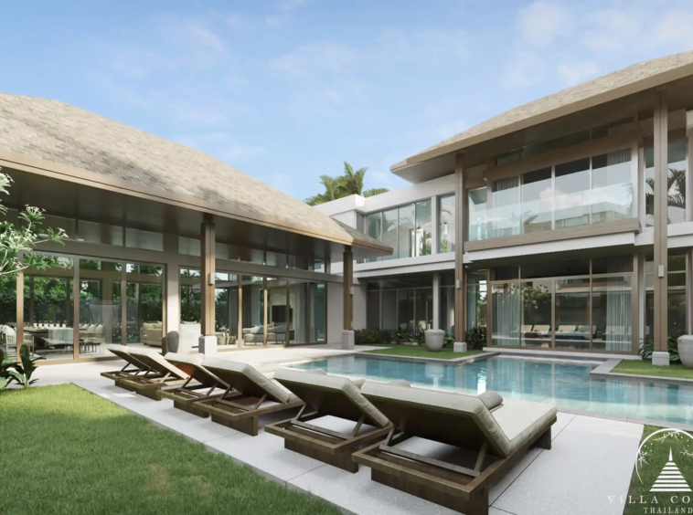 The outdoor area at QAV Residence with sunbeds by the pool.