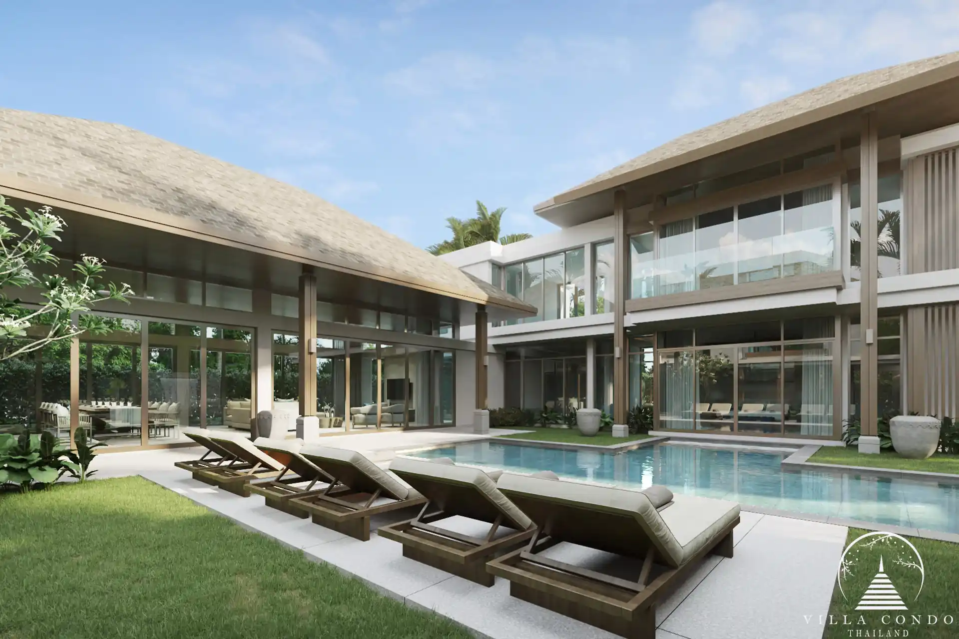 The outdoor area at QAV Residence with sunbeds by the pool.