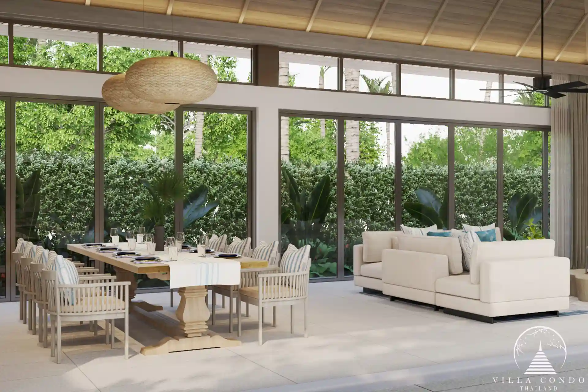 The spacious living area in a QAV Residence villa with panoramic windows.