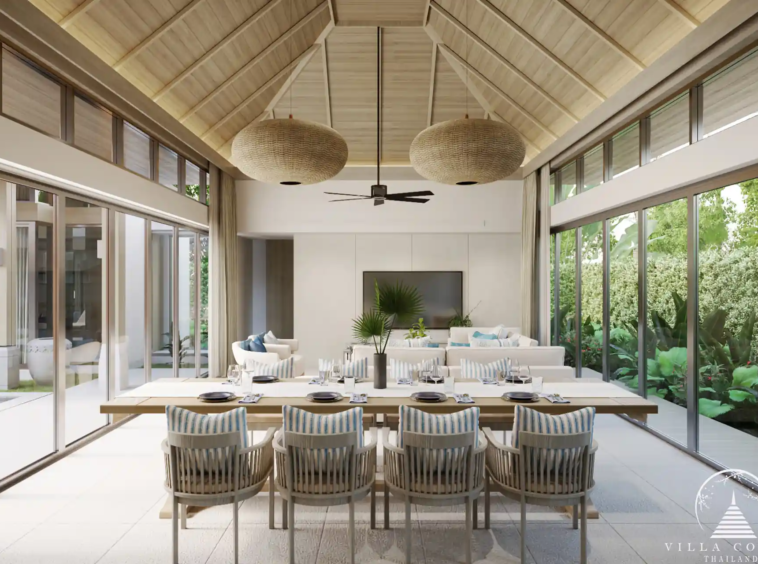 The elegant dining area in a QAV Residence villa with modern decor.