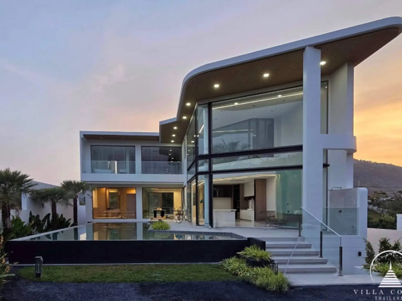 Exterior view of The PRIVA Golf Course Villa with golf course backdrop.