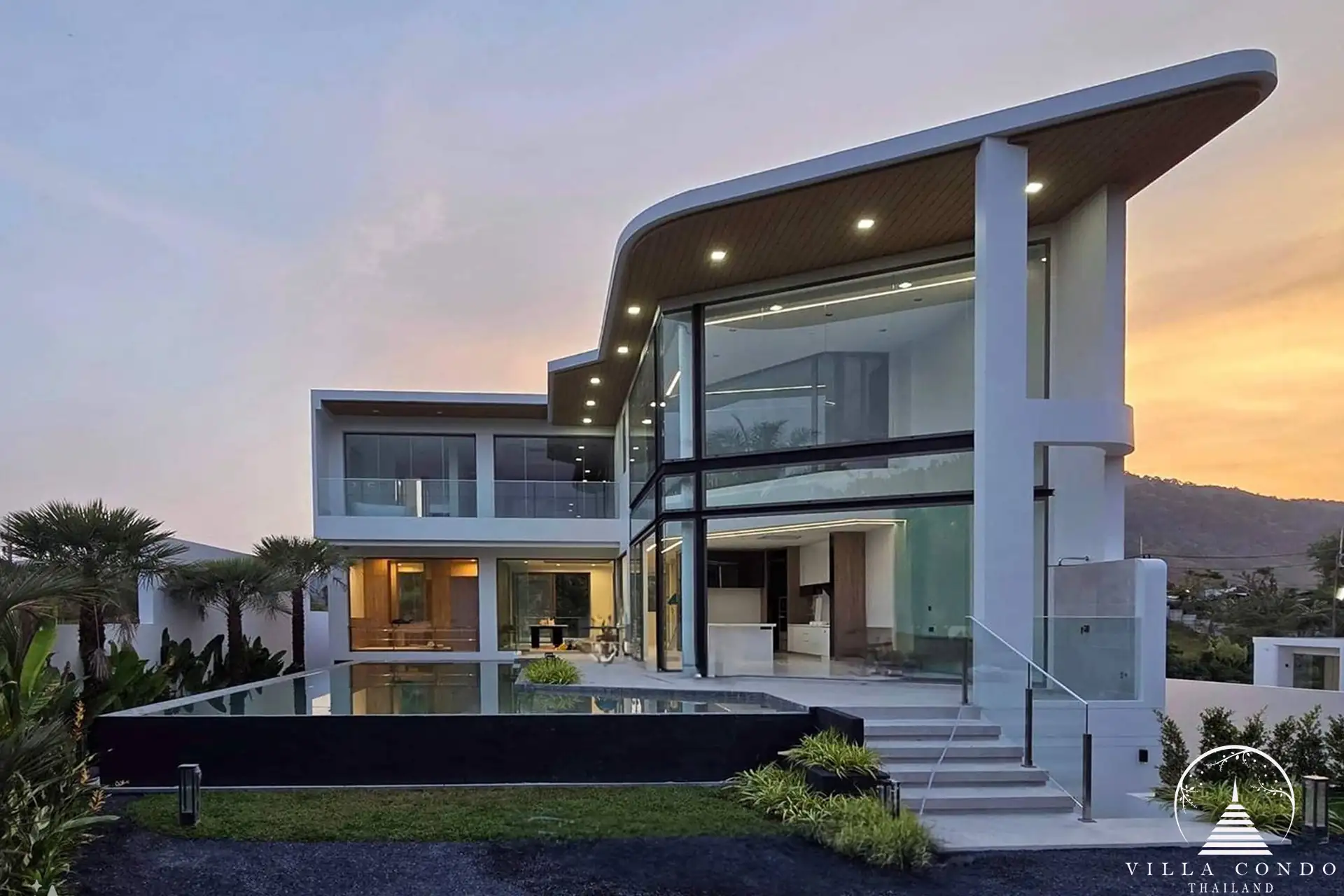 Exterior view of The PRIVA Golf Course Villa with golf course backdrop.