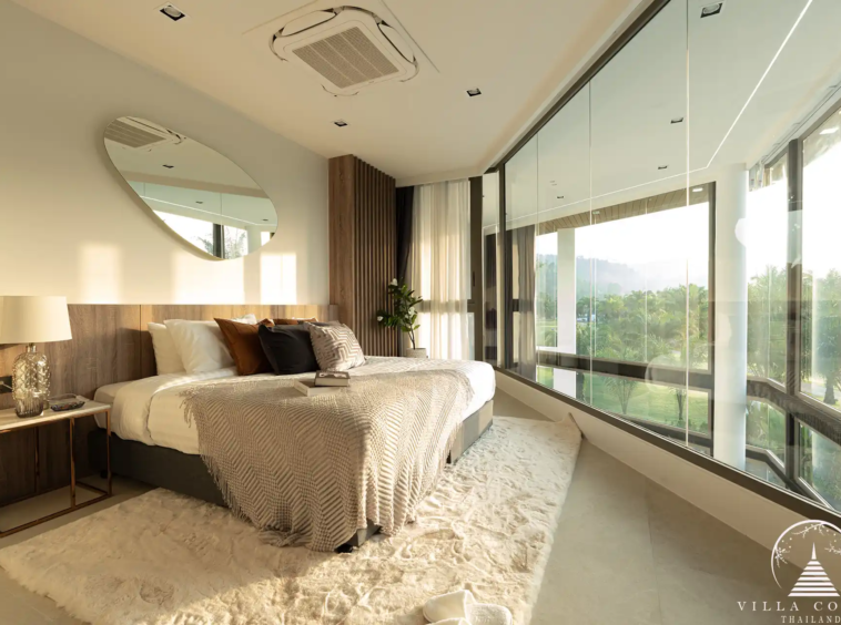Elegant master bedroom with golf course view in The PRIVA Golf Course Villa.