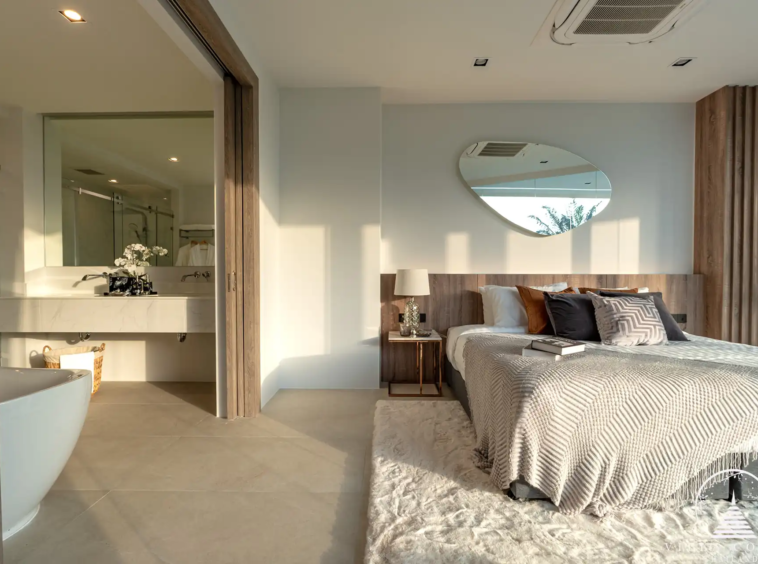 Elegant master bedroom with golf course view in The PRIVA Golf Course Villa.