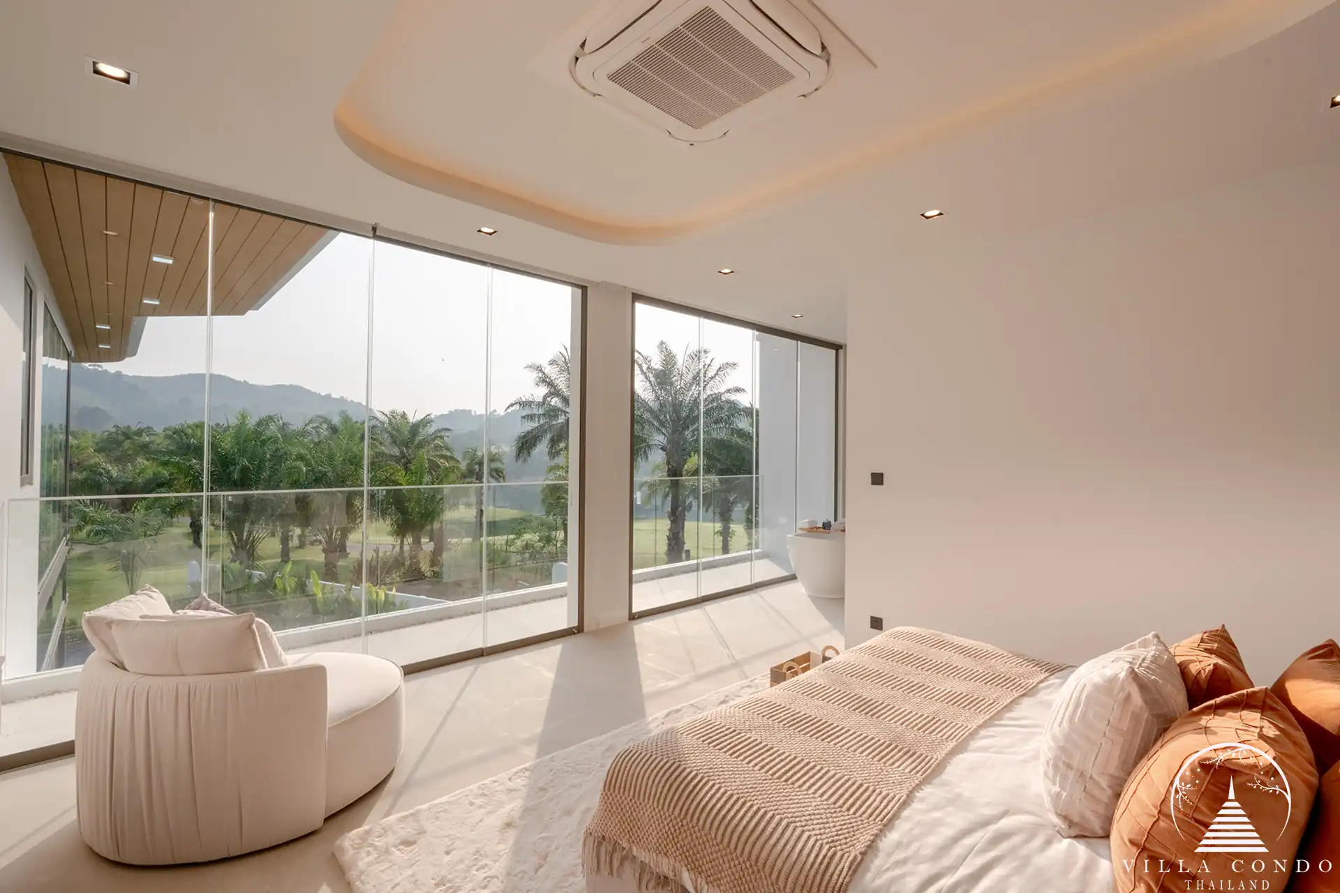 Luxurious bedroom with a view of the golf course in The PRIVA Golf Course Villa.