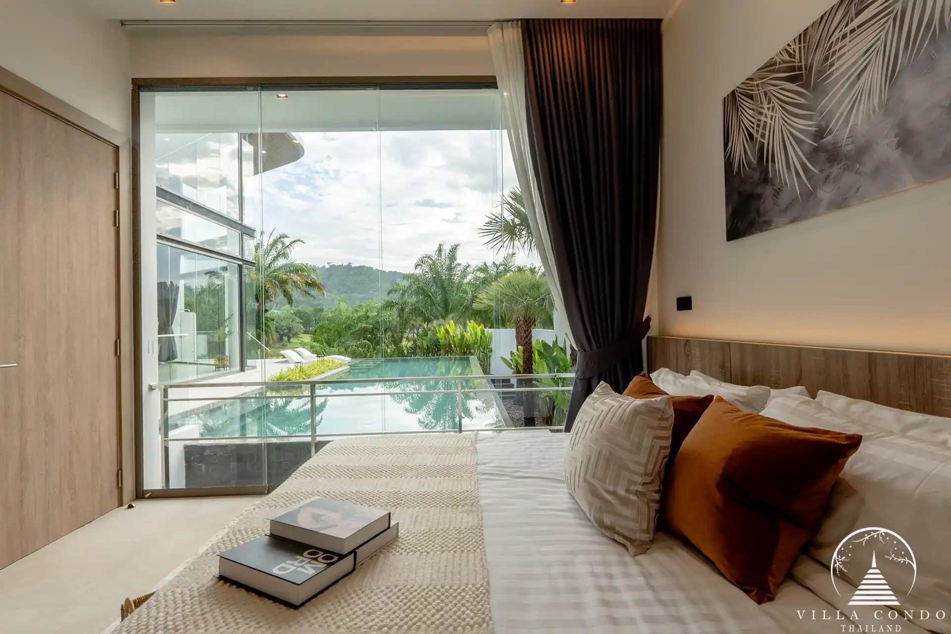 Luxurious bedroom with a view of the golf course in The PRIVA Golf Course Villa.