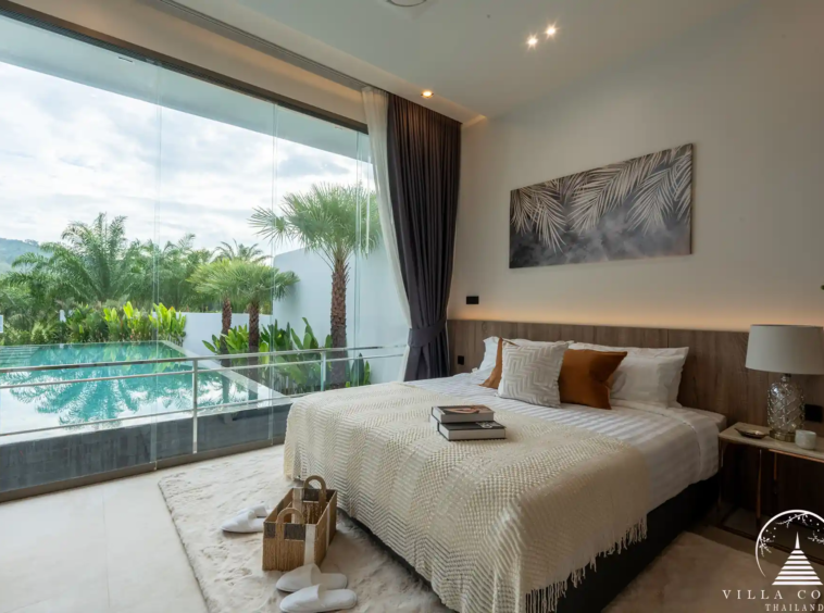 Luxurious bedroom with a view of the golf course in The PRIVA Golf Course Villa.