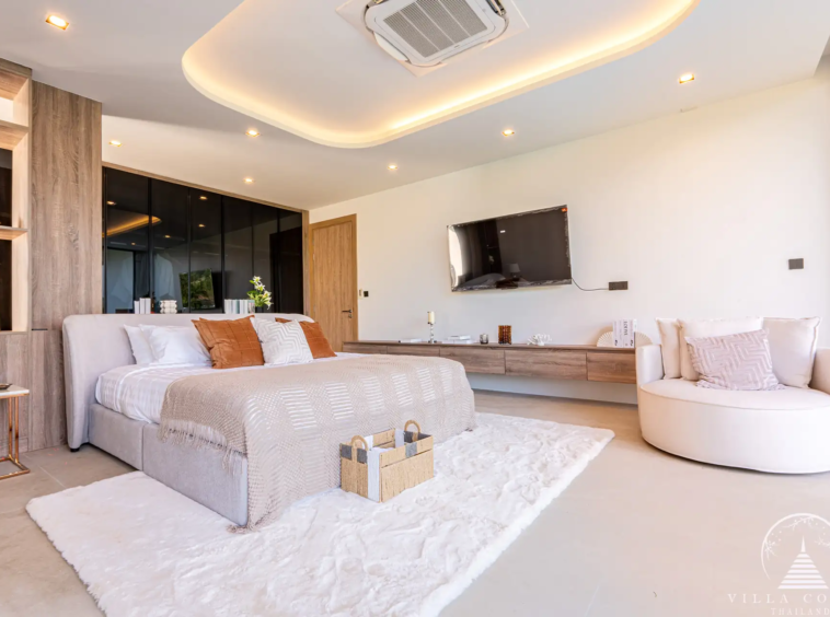 Luxurious bedroom with a view of the golf course in The PRIVA Golf Course Villa.