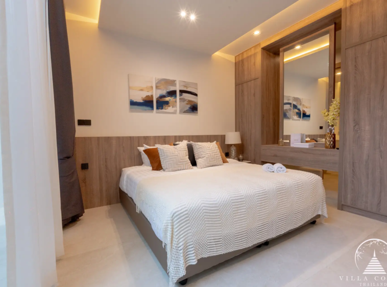 Luxurious bedroom with a view of the golf course in The PRIVA Golf Course Villa.
