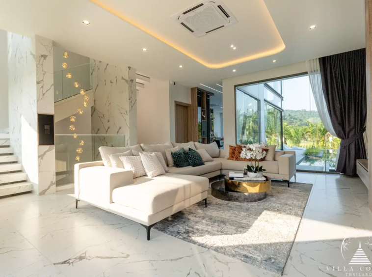 Spacious living area with modern furnishings in The PRIVA Golf Course Villa.