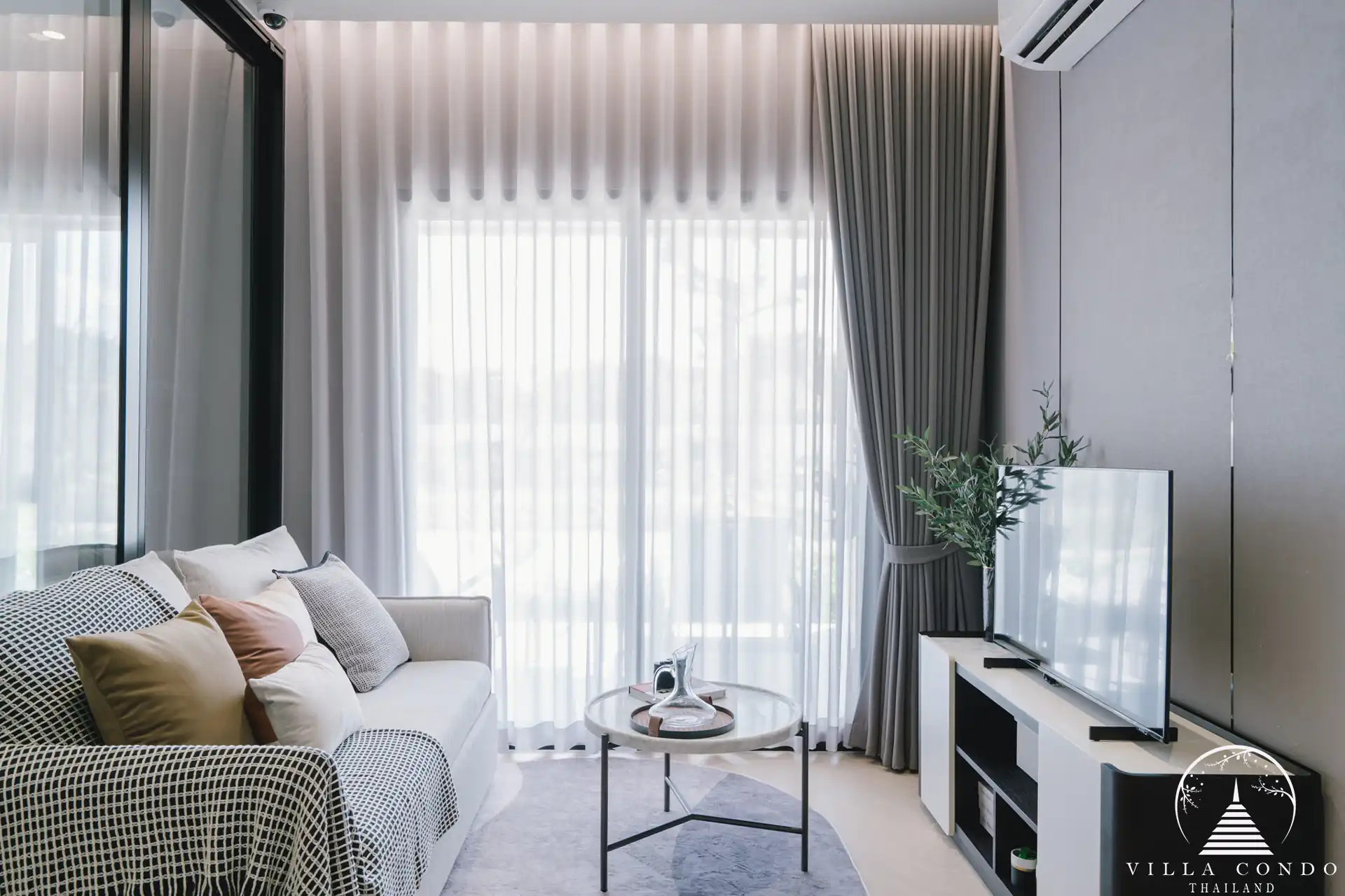 Spacious living area with comfortable seating and modern decor.