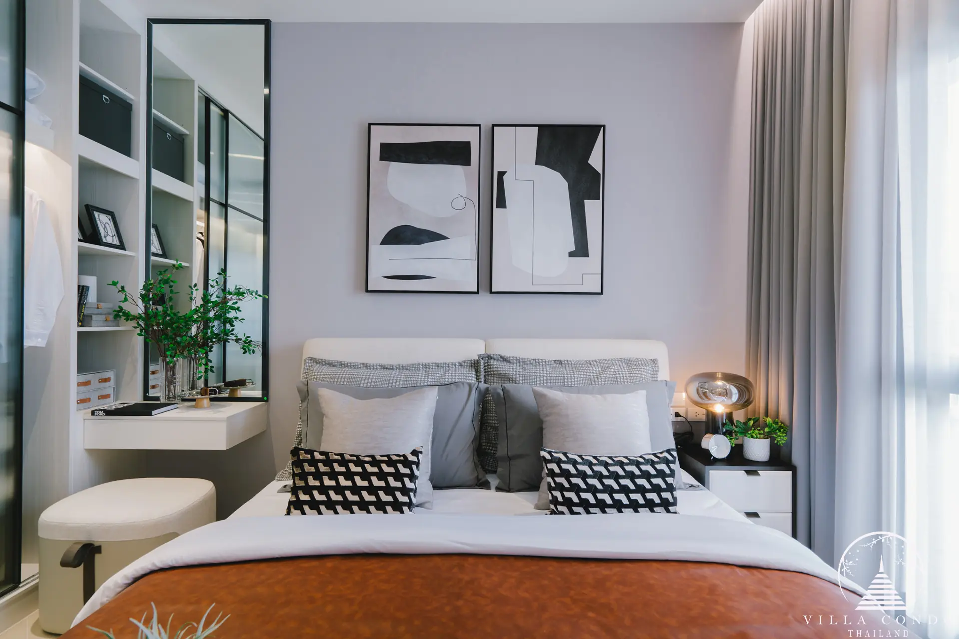 Spacious bedroom with elegant furnishings and decor.