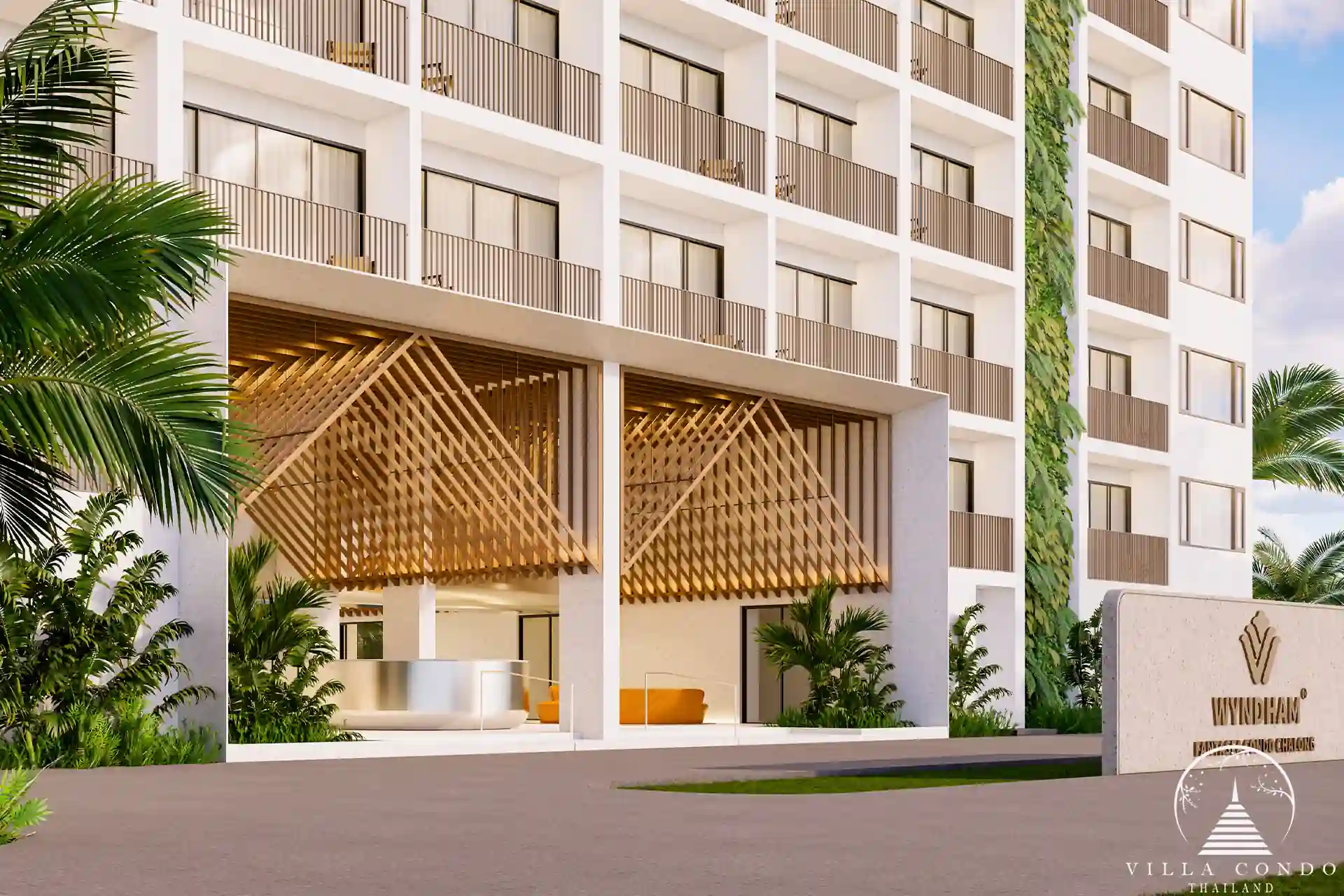 Welcoming entrance of Wyndham Fantasea Condo Chalong, featuring modern design and lush greenery.