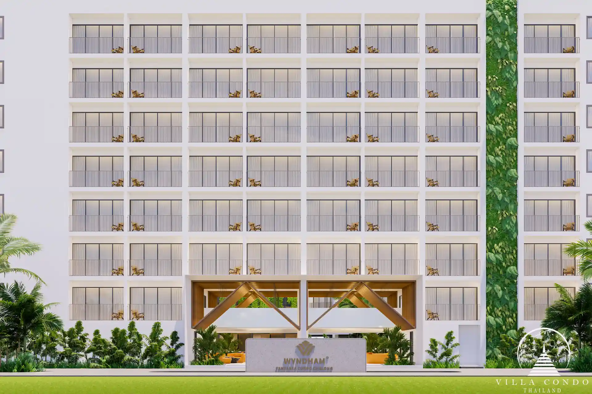 Exterior view of Wyndham Fantasea Condo Chalong, showcasing modern architecture and lush tropical surroundings.