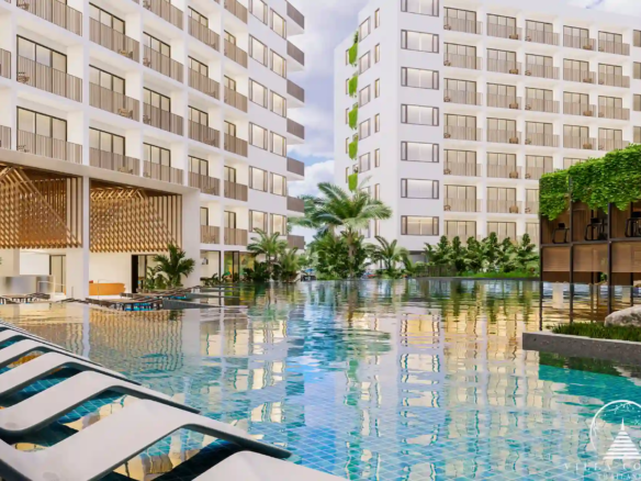 Expansive common pool at Wyndham Fantasea Condo Chalong, surrounded by tropical greenery.