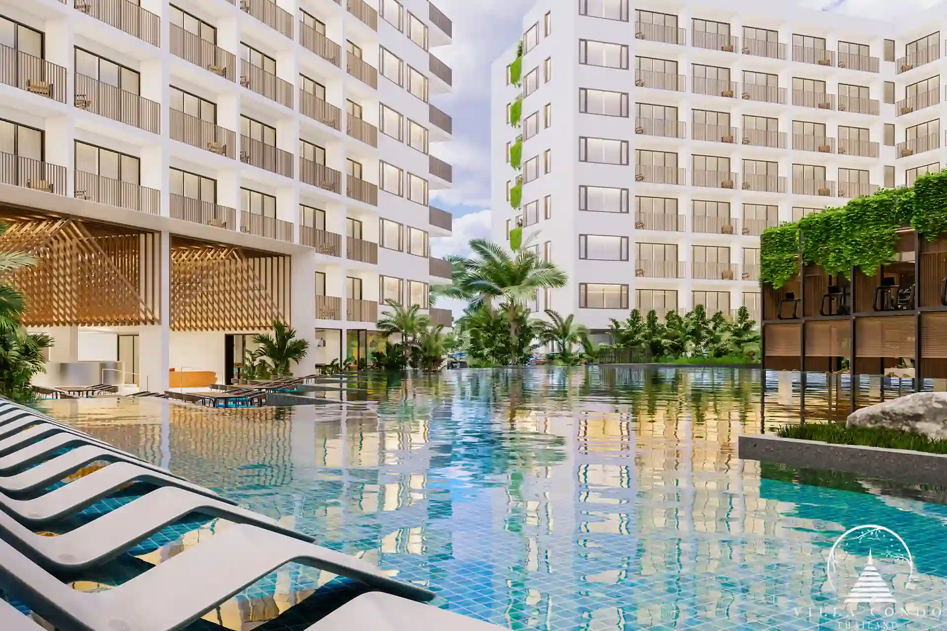 Expansive common pool at Wyndham Fantasea Condo Chalong, surrounded by tropical greenery.