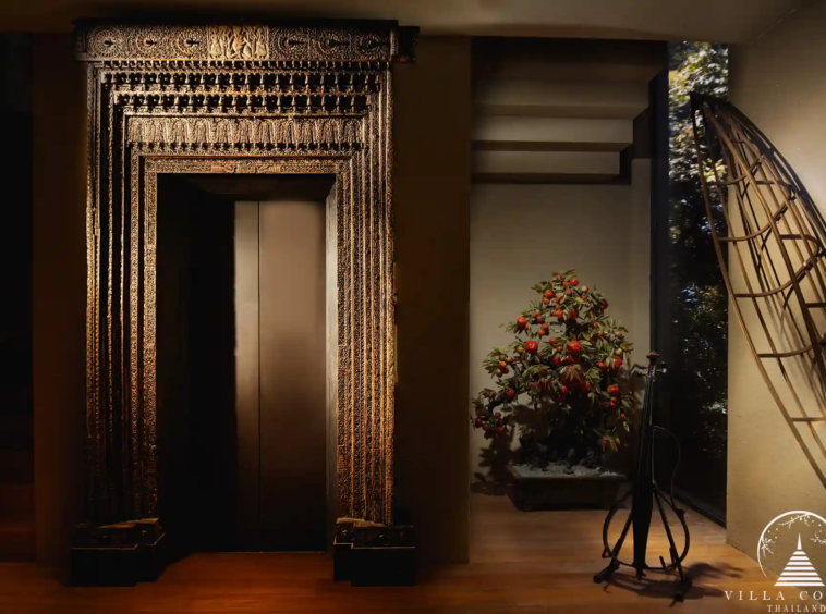Luxurious elevator in Villa Amarisa, with black interiors and gold-plated leaf highlights.