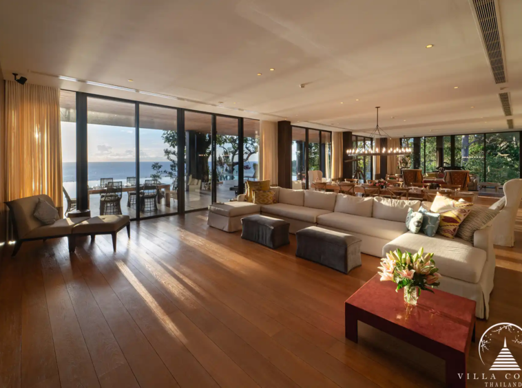 Spacious living area in Villa Amarisa with an L-shaped sofa and ocean views.