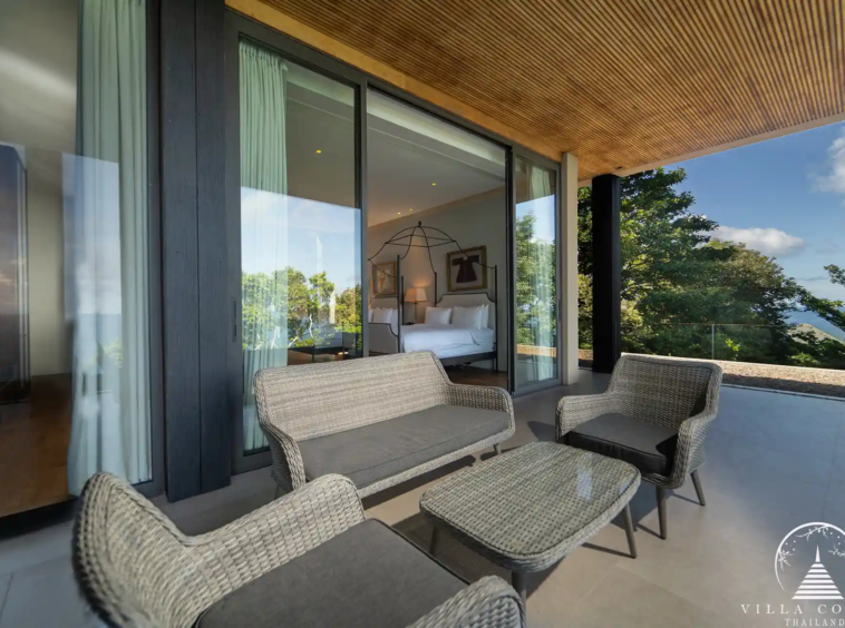 Outdoor living area at Villa Amarisa with plush sun loungers and a shaded terrace.