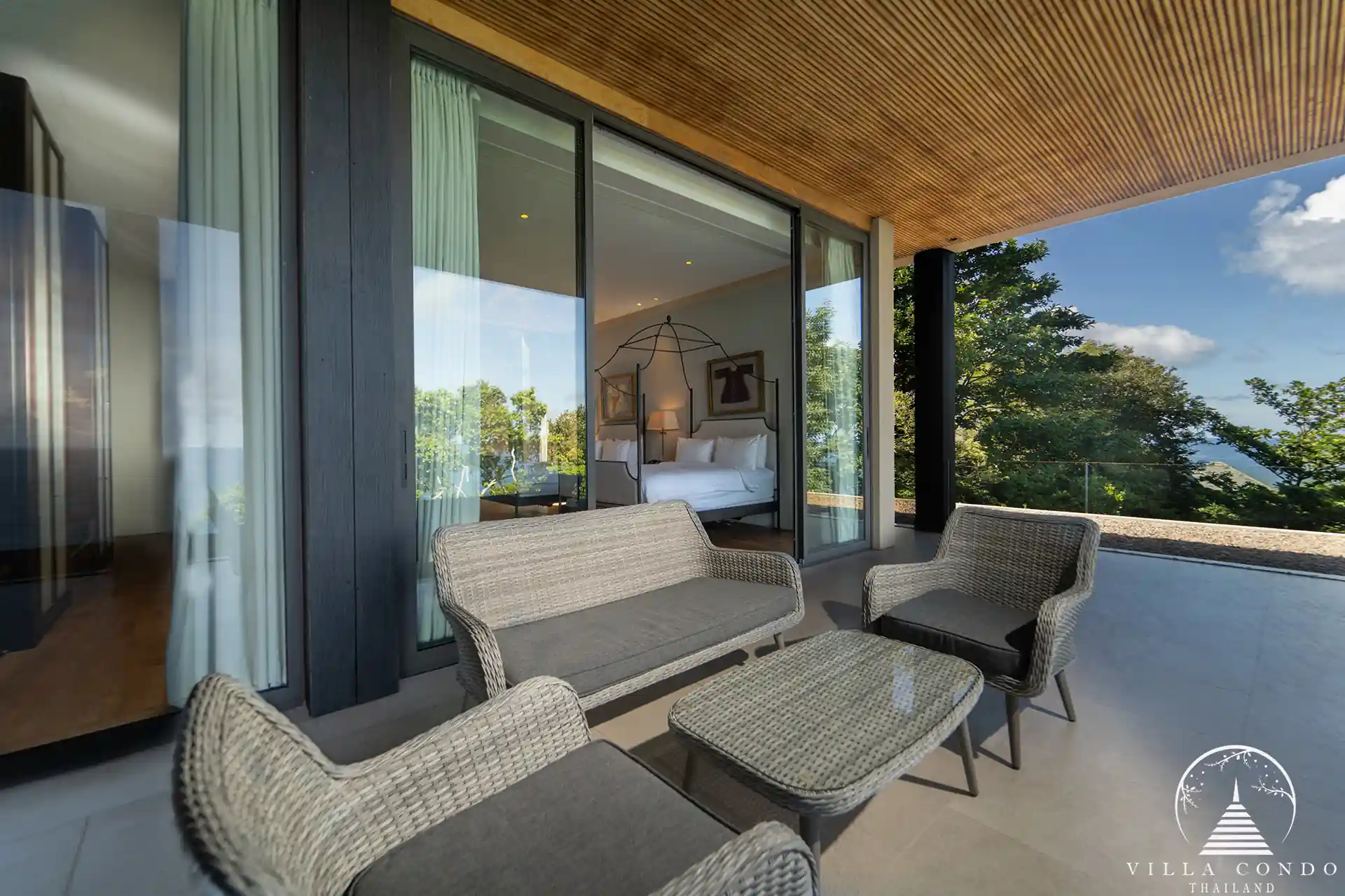 Outdoor living area at Villa Amarisa with plush sun loungers and a shaded terrace.