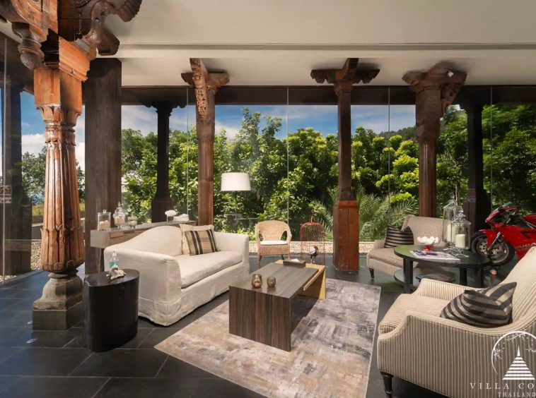 Interior of Villa Amarisa with ornate Indian pillars and teak hardwood flooring.
