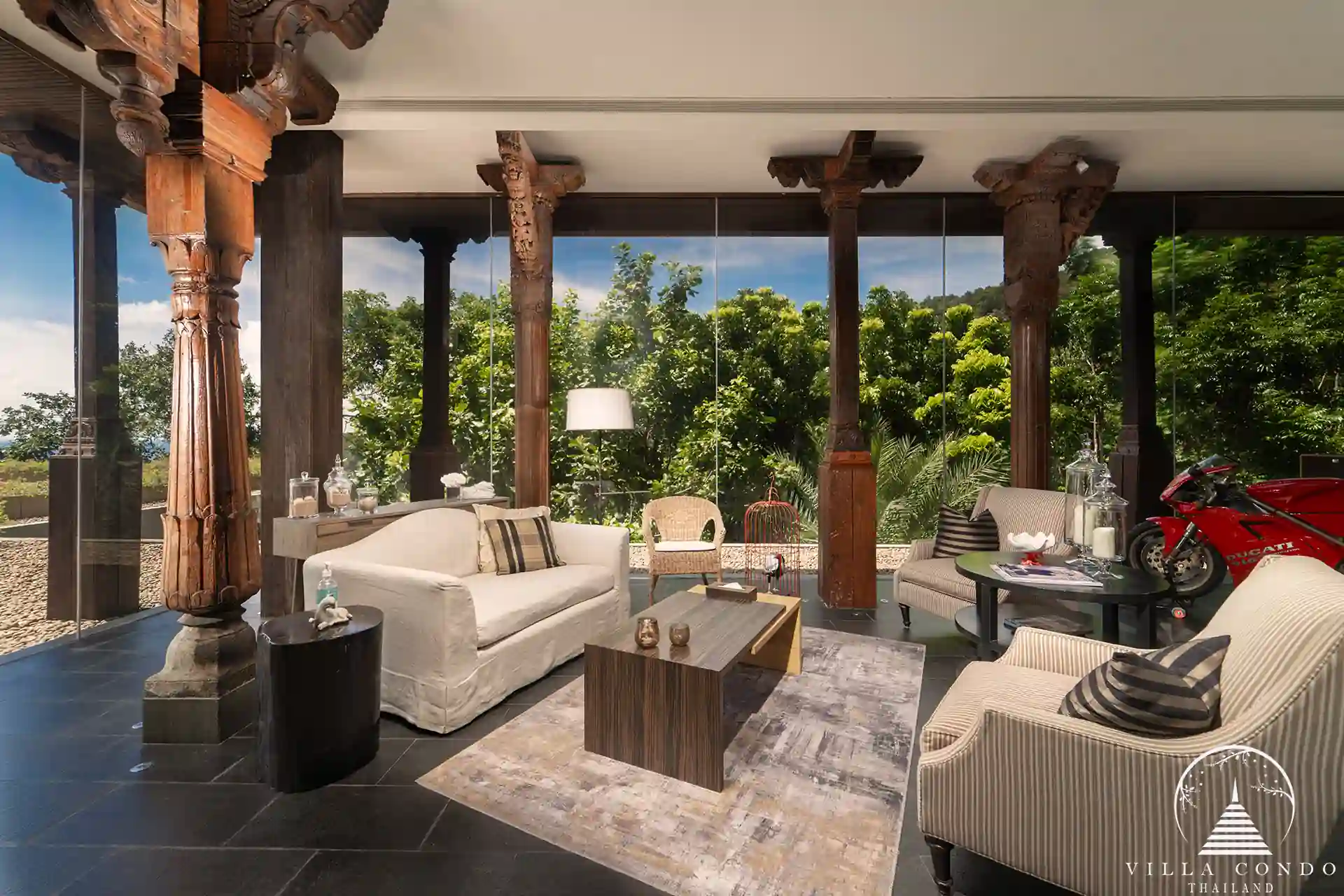 Interior of Villa Amarisa with ornate Indian pillars and teak hardwood flooring.