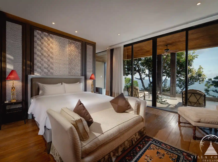 Master bedroom at Villa Amarisa with panoramic sea views and a private balcony.