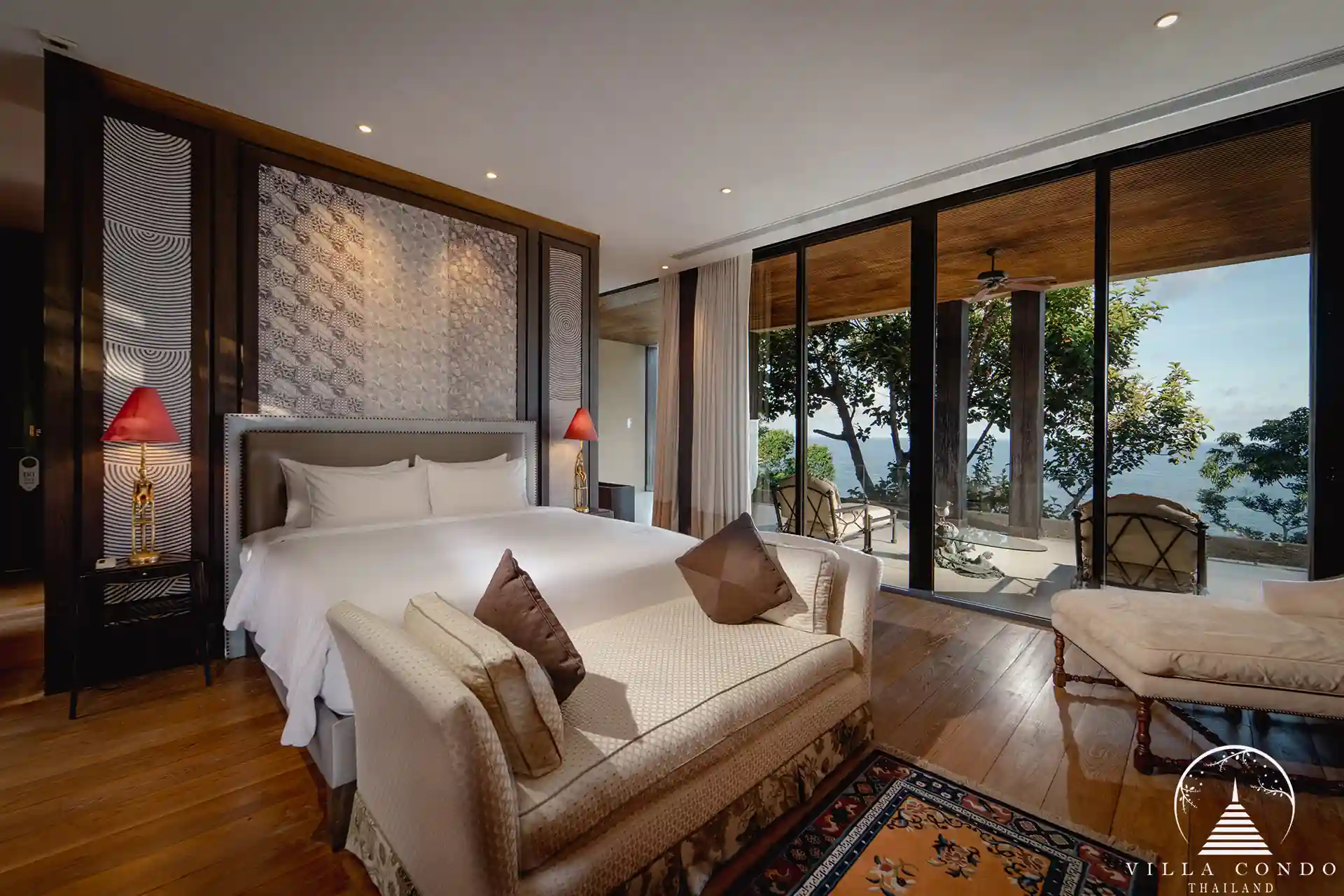Master bedroom at Villa Amarisa with panoramic sea views and a private balcony.